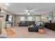 Inviting living room with a large leather sectional sofa, flat screen TV, and cozy decor at 575 Chuli Rd, Locust Grove, GA 30248