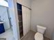 Bathroom featuring modern tiled shower with glass doors and updated toilet at 116 Glendale Dr, Peachtree City, GA 30269