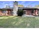 Brick home exterior showing backyard, patio, and brick chimney at 116 Glendale Dr, Peachtree City, GA 30269