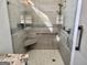 Modern tiled shower with glass door, built in bench, and rainfall shower head at 116 Glendale Dr, Peachtree City, GA 30269