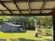 Large backyard showcasing a shed, trees, and a well-maintained lawn at 266 Ridge Trl, Riverdale, GA 30274