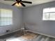 Bright bedroom featuring two windows and modern flooring, ready for personalization at 266 Ridge Trl, Riverdale, GA 30274