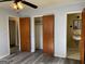 Bedroom with multiple doorways, leading to a bathroom and closet space, featuring new flooring at 266 Ridge Trl, Riverdale, GA 30274
