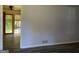 Inviting room with sliding doors to a covered patio and stylish gray flooring at 266 Ridge Trl, Riverdale, GA 30274