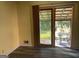 Interior view of sliding doors to an outdoor patio with an iron table and chairs at 266 Ridge Trl, Riverdale, GA 30274