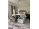Serene bedroom featuring a tray ceiling, plush armchairs, and elegant decor providing a relaxing retreat at 813 Creekgarden Court, Atlanta, GA 30339