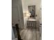 Hallway showcasing a decorative mirror, a stylish table and view of the stairway at 813 Creekgarden Court, Atlanta, GA 30339