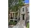 Charming townhome with brick facade, wrought iron balcony, and inviting front porch, creating an elegant curb appeal at 813 Creekgarden Court, Atlanta, GA 30339