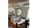 Bright living room featuring hardwood floors, elegant furniture, and coffered ceilings providing an open and airy atmosphere at 813 Creekgarden Court, Atlanta, GA 30339
