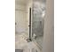 Modern bathroom with a glass-enclosed shower featuring marble tiling offering a clean and luxurious feel at 813 Creekgarden Court, Atlanta, GA 30339