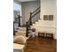 Elegant staircase with dark wood and patterned carpet, complemented by stylish decor for a welcoming ambiance at 813 Creekgarden Court, Atlanta, GA 30339