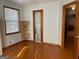 Bright bedroom with polished hardwood floors and access to an attached bathroom for added convenience at 6099 Winview Dr, Forest Park, GA 30297