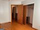 A bedroom featuring wood floors, and a closet with sliding doors at 6099 Winview Dr, Forest Park, GA 30297