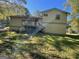 Back exterior with deck, stairs and siding plus a view of the grass yard at 6332 Valley Dale Dr, Riverdale, GA 30274