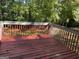 Spacious deck overlooking a large yard surrounded by mature trees, great for outdoor entertaining at 6332 Valley Dale Dr, Riverdale, GA 30274