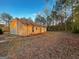 Wide shot of home's back exterior, featuring a large yard at 117 Old Stagecoach Rd, Carrollton, GA 30116