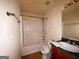 Bathroom with sink vanity, shower with tub, and tile flooring at 117 Old Stagecoach Rd, Carrollton, GA 30116