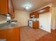 Kitchen with countertops, gas range, tile flooring and ample cabinet space at 117 Old Stagecoach Rd, Carrollton, GA 30116