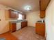 Efficient kitchen featuring a gas range, updated countertops, and tile flooring at 117 Old Stagecoach Rd, Carrollton, GA 30116