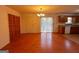 Living and dining area with hardwood floors, closet space, and kitchen access at 117 Old Stagecoach Rd, Carrollton, GA 30116