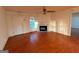 Inviting living room with a fireplace, hardwood floors, and ample natural light at 117 Old Stagecoach Rd, Carrollton, GA 30116