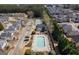 Aerial view of community pool, tennis court and surrounding houses at 4654 Liberty Square Dr, Acworth, GA 30101