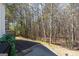 A brick patio offers a relaxing view of the property's lovely wooded area at 4654 Liberty Square Dr, Acworth, GA 30101