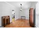 Bright dining room with hardwood floors and modern lighting; kitchen visible in background at 4654 Liberty Square Dr, Acworth, GA 30101