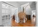 Welcoming foyer featuring hardwood floors, a staircase, and a decorative peacock chair at 4654 Liberty Square Dr, Acworth, GA 30101