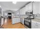 An open kitchen featuring modern appliances and a seamless view into the living room at 4654 Liberty Square Dr, Acworth, GA 30101