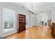 Inviting living room with hardwood floors, large windows, and a view of the front yard at 4654 Liberty Square Dr, Acworth, GA 30101
