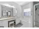 Spacious main bathroom featuring double sinks, vanity area, soaking tub, and a shower at 4654 Liberty Square Dr, Acworth, GA 30101