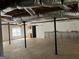 Unfinished basement with exposed ceiling, concrete floor, and natural light at 9039 River Bend Ct, Villa Rica, GA 30180
