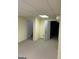 View of the basement with neutral carpet, yellow walls, and white trim around doors, creating a clean look at 9039 River Bend Ct, Villa Rica, GA 30180