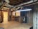 Unfinished basement with utility connections and storage; ready to be finished at 9039 River Bend Ct, Villa Rica, GA 30180
