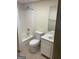 Full bathroom features a shower-tub combo, tile floor, a white toilet and a vanity sink with a mirror at 9039 River Bend Ct, Villa Rica, GA 30180