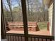 Enjoy this home's wooden deck perfect for relaxing and entertaining guests outdoors at 9039 River Bend Ct, Villa Rica, GA 30180