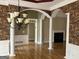 Dining room featuring hardwood floors, wainscoting, wallpaper, and a chandelier at 9039 River Bend Ct, Villa Rica, GA 30180