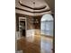 Dining room features hardwood floors, wainscoting, wallpaper, and a large window at 9039 River Bend Ct, Villa Rica, GA 30180