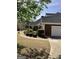 Well-maintained home with a three car garage, manicured hedges and a curved driveway at 9039 River Bend Ct, Villa Rica, GA 30180