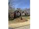 Charming brick home featuring manicured landscaping and a classic architectural design with a well-maintained lawn at 9039 River Bend Ct, Villa Rica, GA 30180