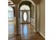 Open entryway features hardwood floors, archways, and an elegant front door at 9039 River Bend Ct, Villa Rica, GA 30180