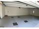 Spacious garage with painted walls and concrete floor. Ideal for parking and storage at 9039 River Bend Ct, Villa Rica, GA 30180