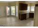 This kitchen features granite counters, dark cabinets, and natural light from the many large windows at 9039 River Bend Ct, Villa Rica, GA 30180