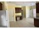 Kitchen view featuring dark wood cabinets, tile flooring, and granite countertops at 9039 River Bend Ct, Villa Rica, GA 30180