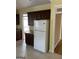 Kitchen featuring dark wood cabinets, tile flooring, and granite countertops at 9039 River Bend Ct, Villa Rica, GA 30180
