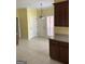 Eat-in kitchen area with dark wood cabinets, tile flooring, and natural light at 9039 River Bend Ct, Villa Rica, GA 30180