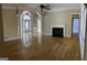 Bright living area features hardwood floors, fireplace, archways, and lovely trim at 9039 River Bend Ct, Villa Rica, GA 30180