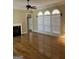 Spacious living room boasting hardwood floors, fireplace, and large windows with decorative trim at 9039 River Bend Ct, Villa Rica, GA 30180