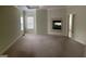 Spacious main bedroom with plush carpet, a fireplace, and natural light at 9039 River Bend Ct, Villa Rica, GA 30180